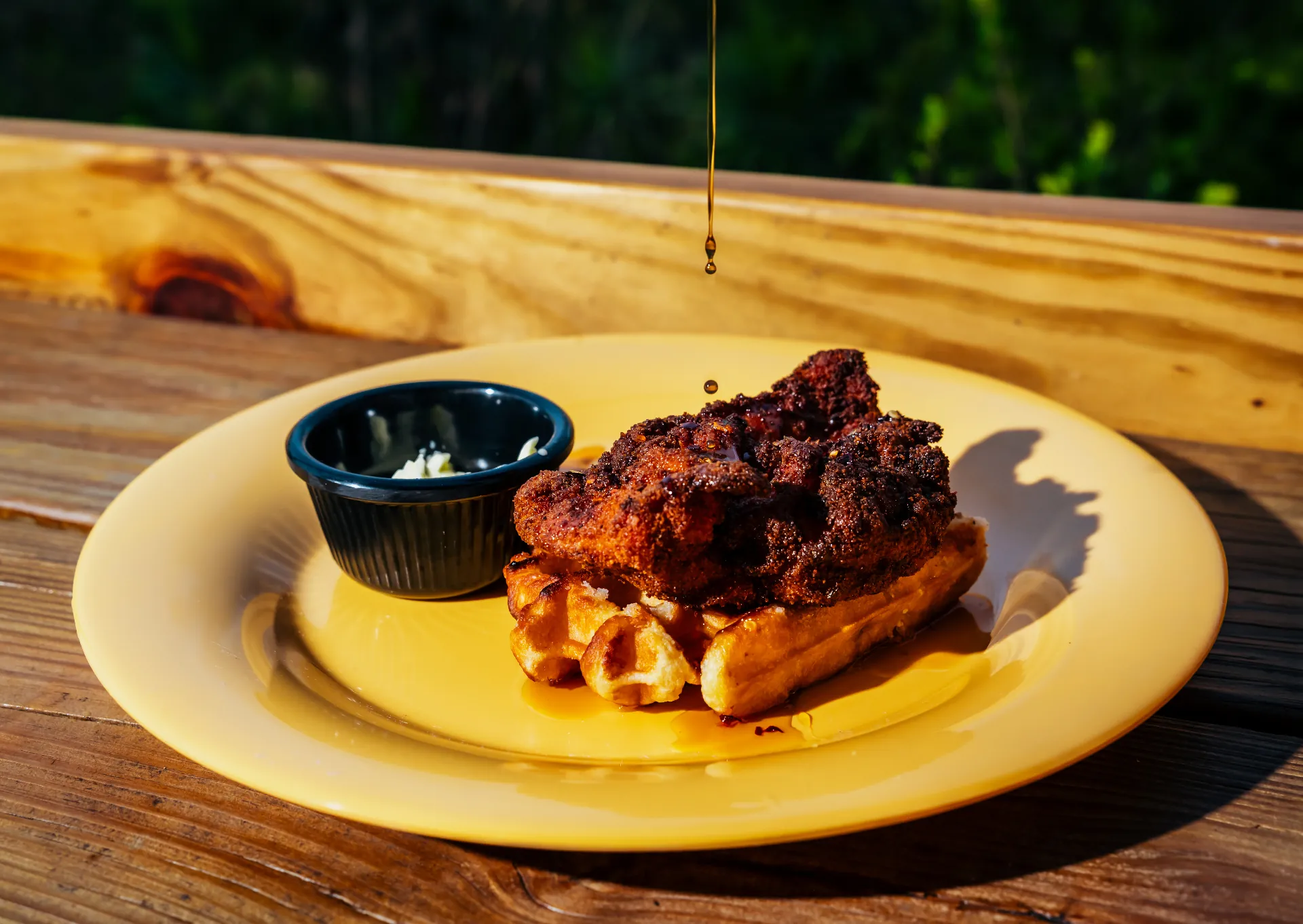 Hot honey poured over Drifters chicken and waffle sliders